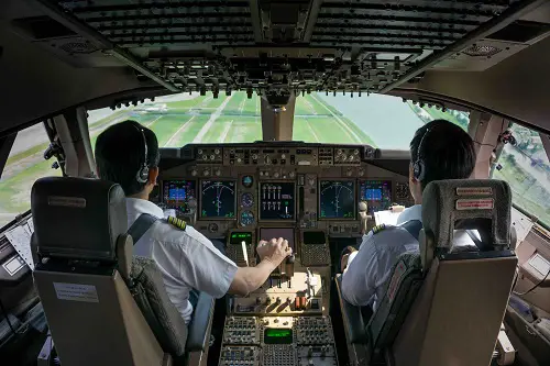 Azores Airlines come on board with skybook. Image shows pilots in the cockpit coming into land